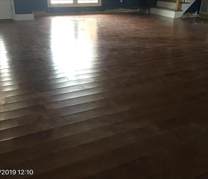 Solid wooden floors that have been saturated with water.