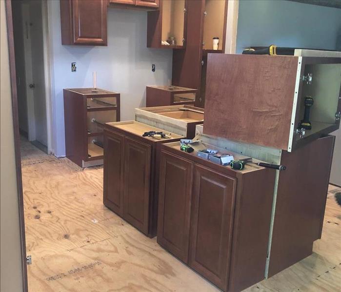 Kitchen during the remodel.  Walls have been moved and cabinets are being placed.