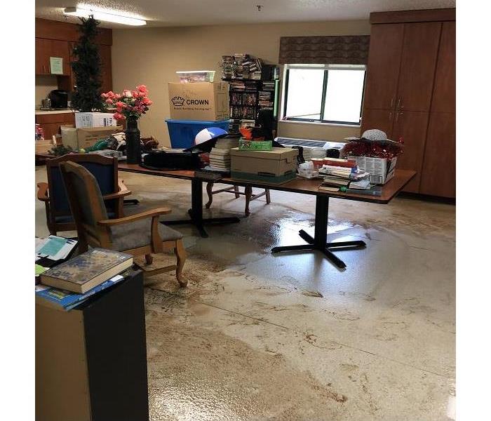 activity room with water and mud covering the floor