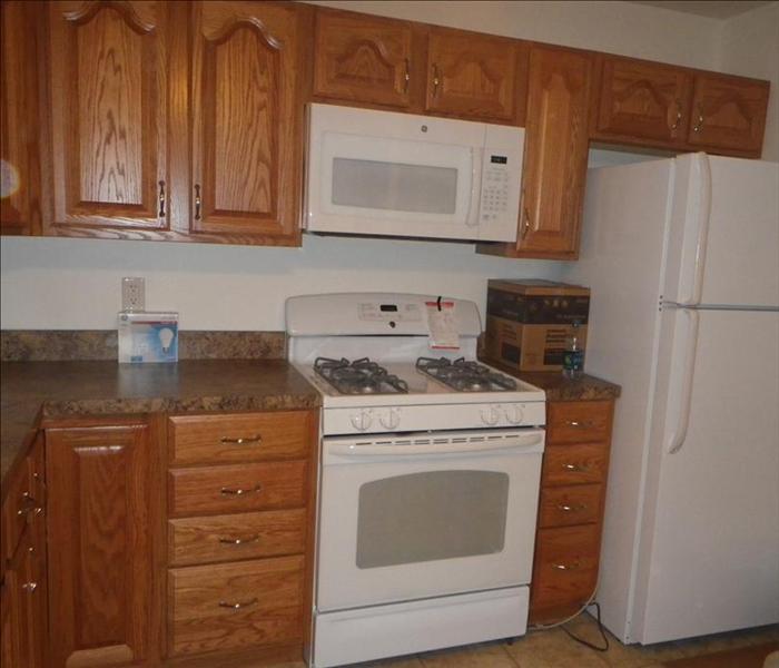 Completely remodeled kitchen with new appliances after the fire restoration.  