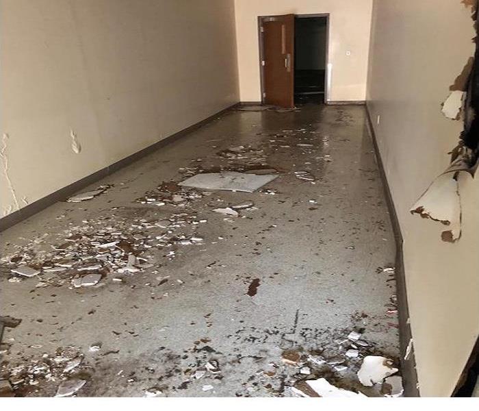 Water damage in a commercial building hallway caused by a frozen pipes.