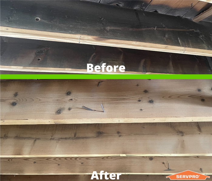 The top of the photo shows soot damaged wood. The bottom shows that the wood has been cleaned.