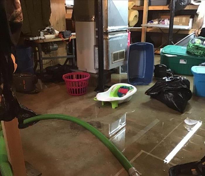 Basement storage area with water all over floor